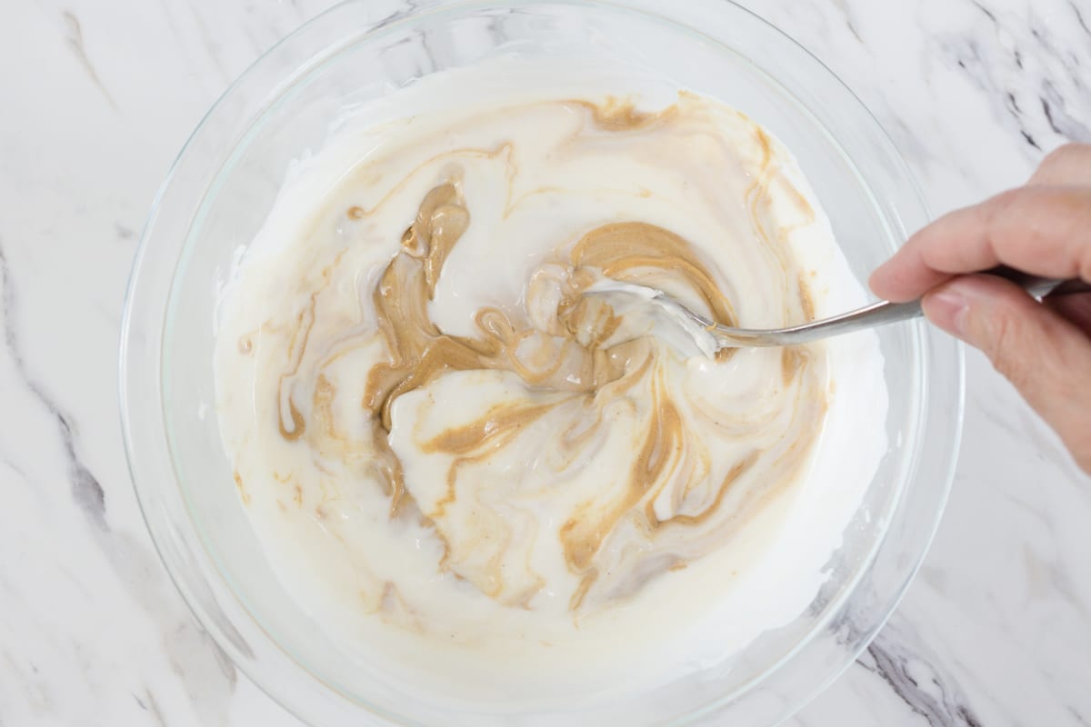 Mix Peanut Butter with melted white chocolate in bowl