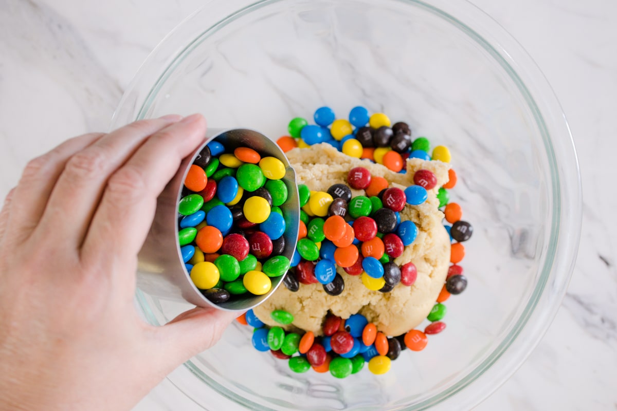 adding M&M Candy Pieces to cookie dough