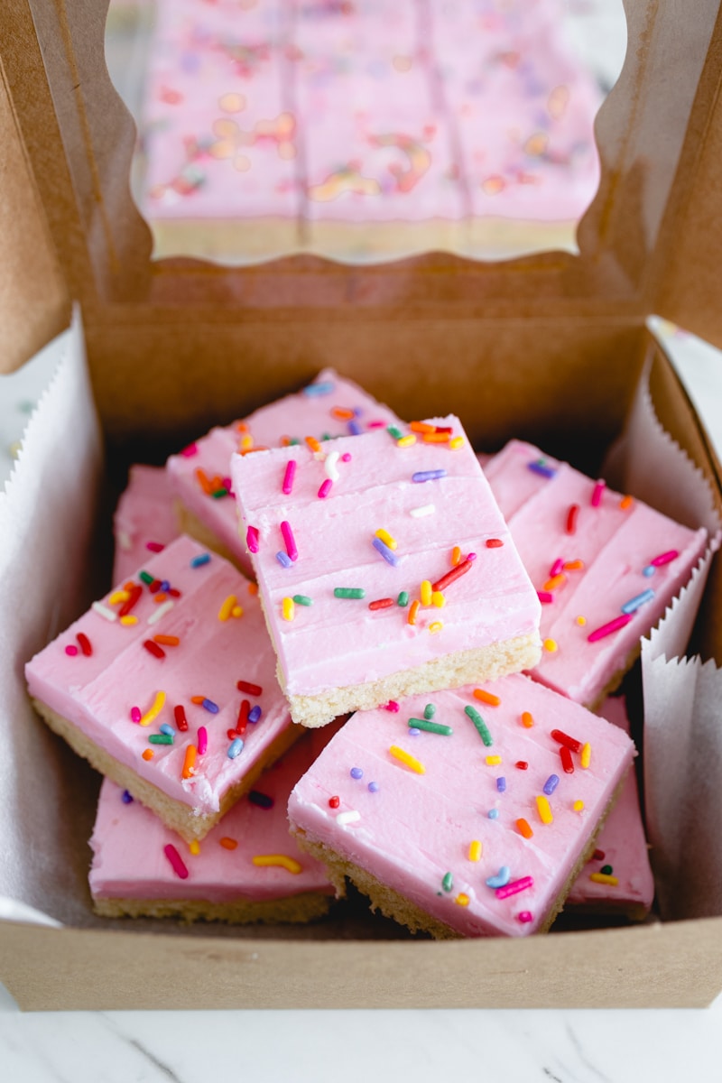 Sugar Cookie Bar Recipe cut in squares in serving box