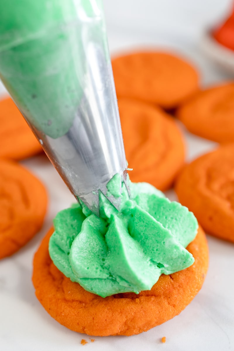 Frost cookies with buttercream frosting