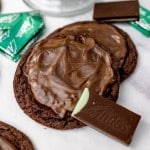 Top view of Andes Creme de menthe Mint Cookies on a counter with Andes mints around them.