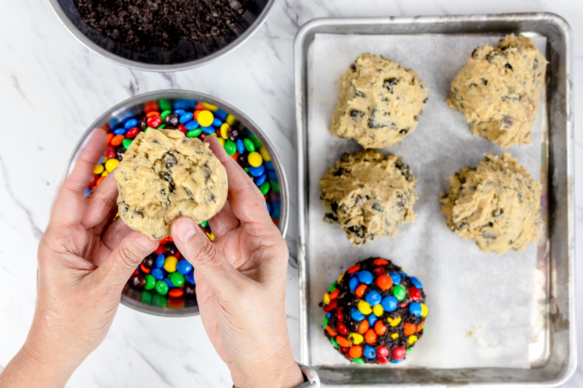 Roll cookie dough into M&M Candy pieces