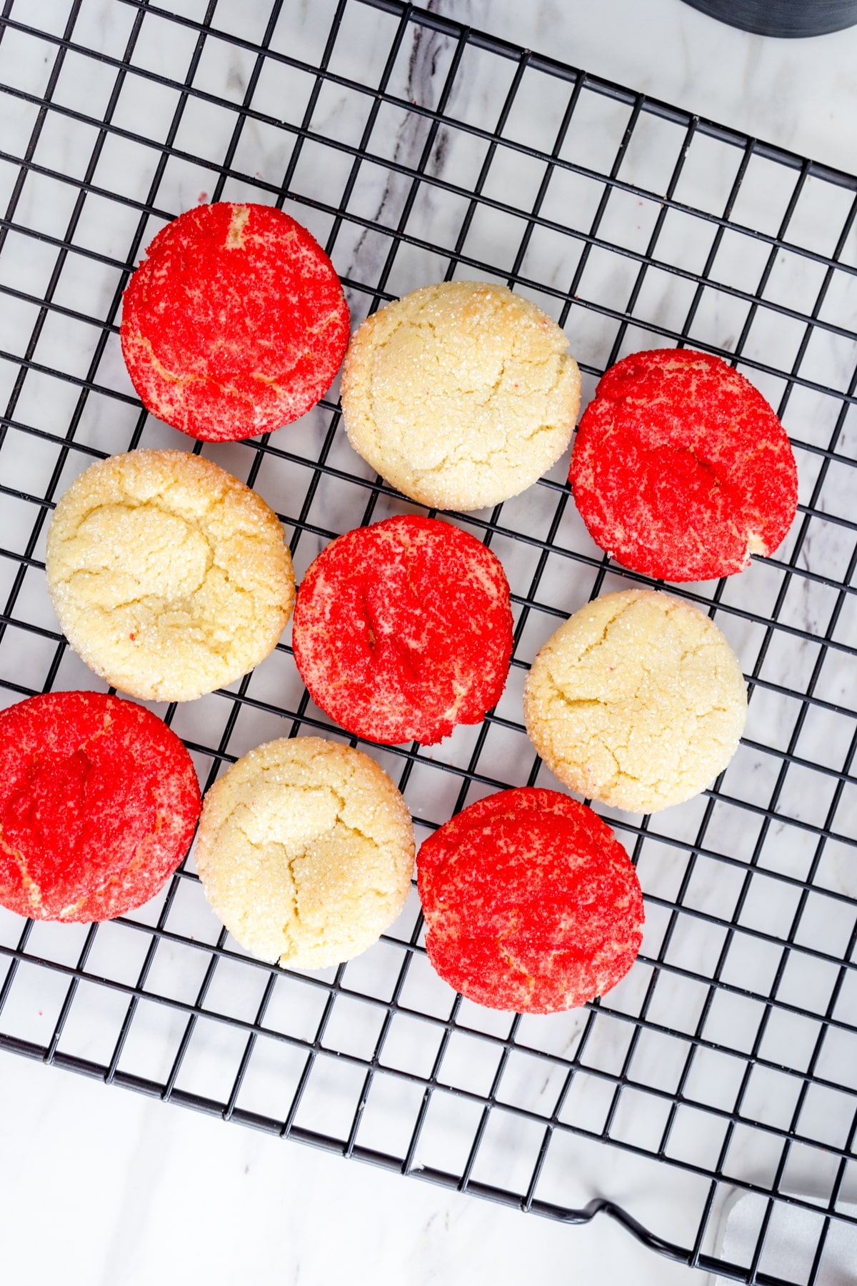 Top view of sugar cookies on a wire rack.