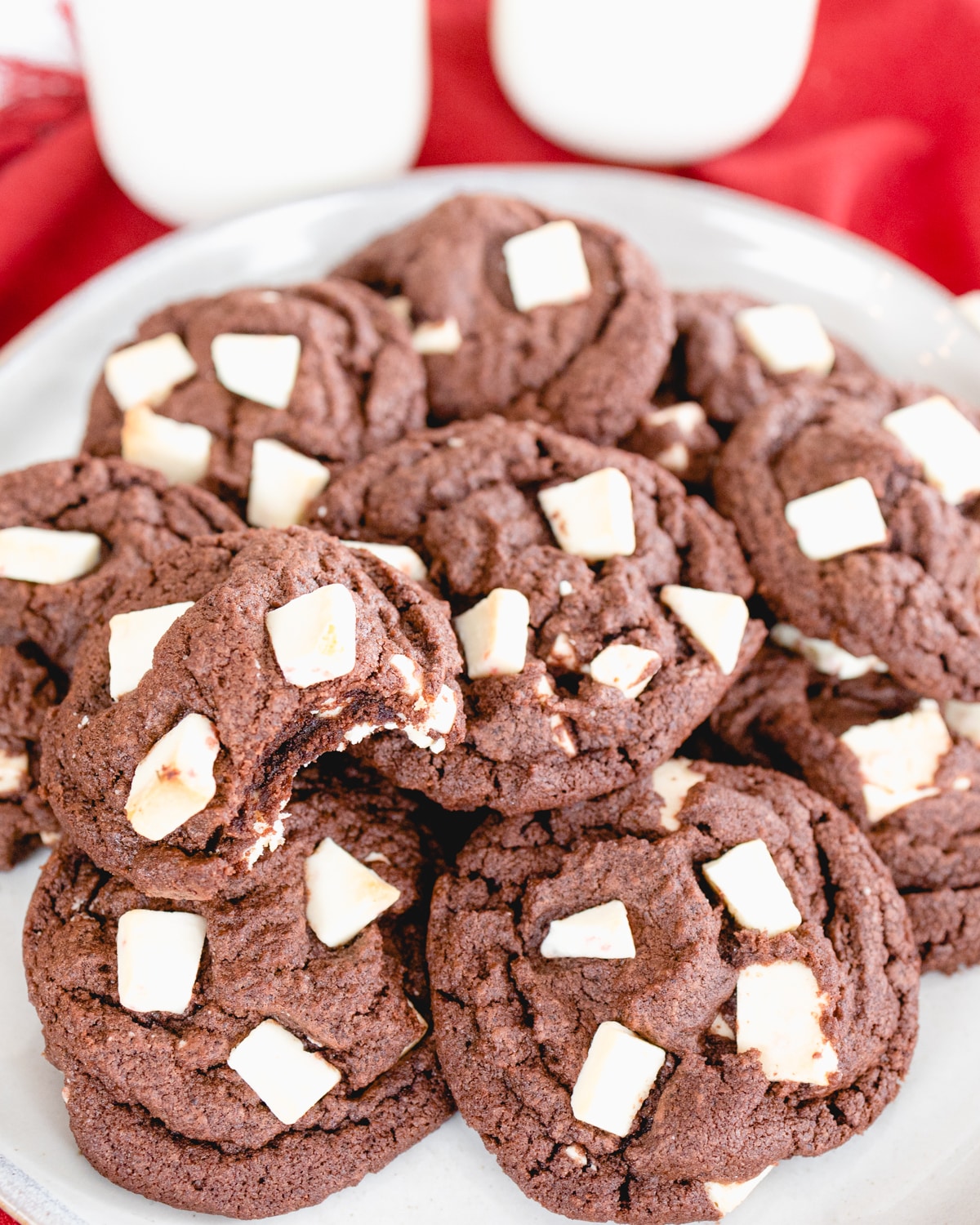 Top view of peppermint bark cookies on a white plate. 