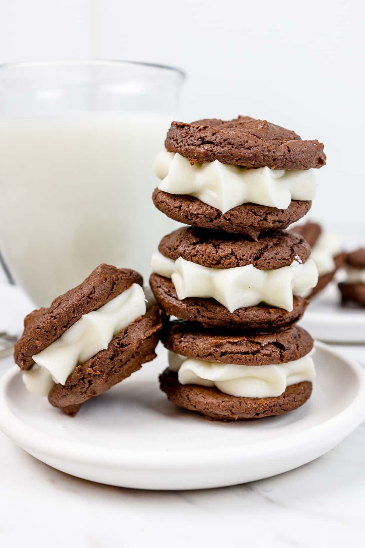Hero image of a stack of Oreo Cakester cookies in a pile on a white plate.