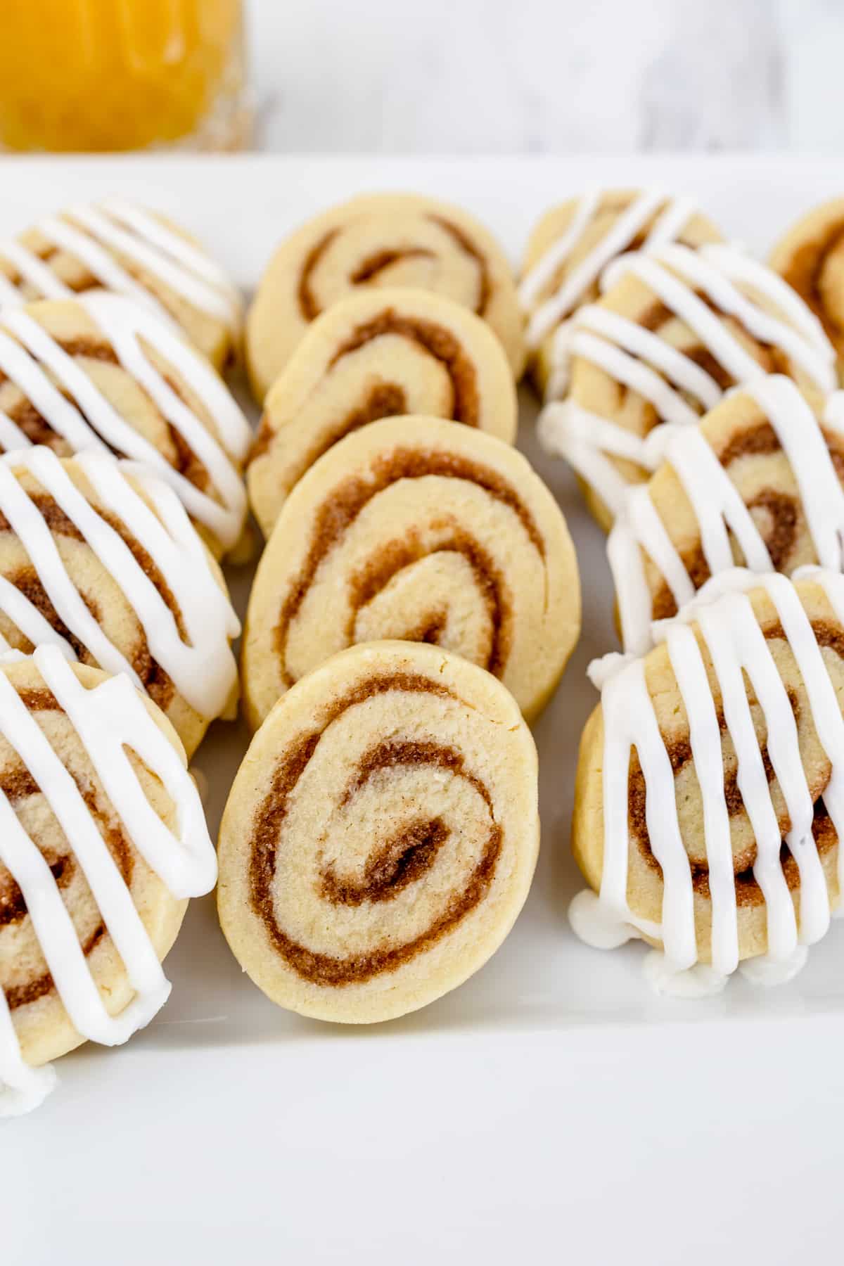 Close-up of cinnamon roll cookies on a white plate. 