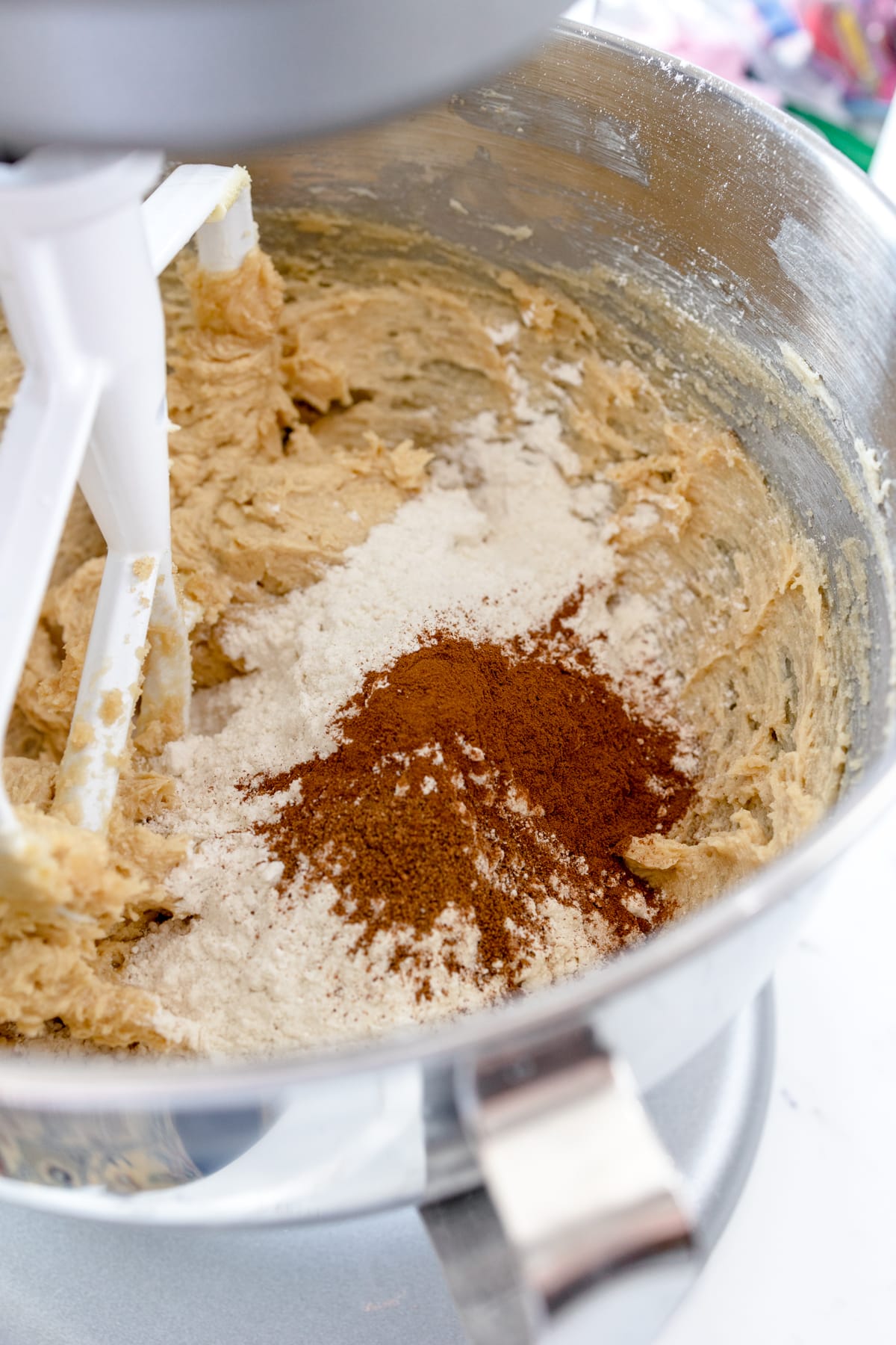 Close up of creamed butter and sugar with flour and spices added in. 