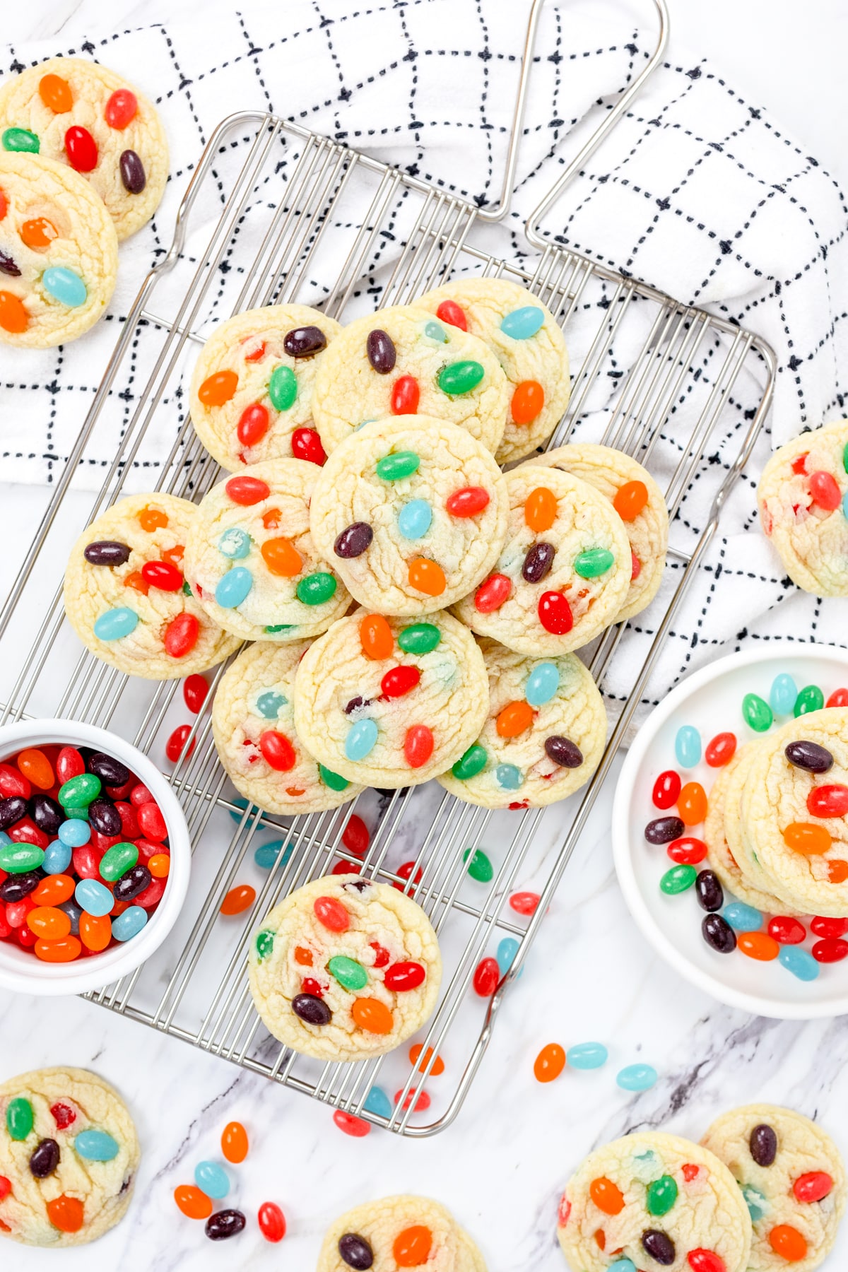 Top view of a pile of Jelly Bean Cookies on a wire rack. 