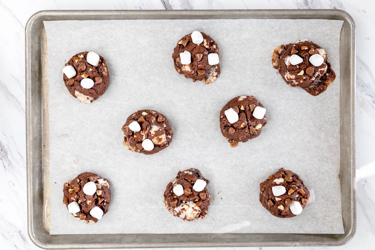 Top view of rocky road cookies on a baking tray. 