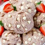 Close-up of Strawberry White Chocolate Chip Cookies in a pile.