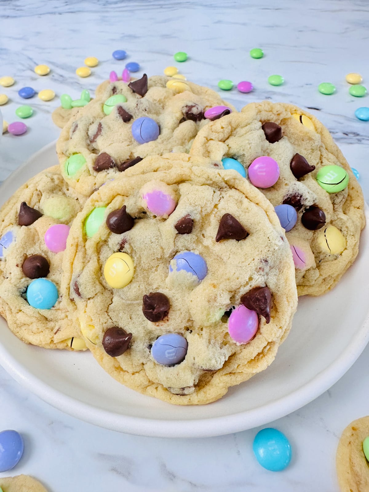 Close up of a plate filled with Easter M&M Cookies. 