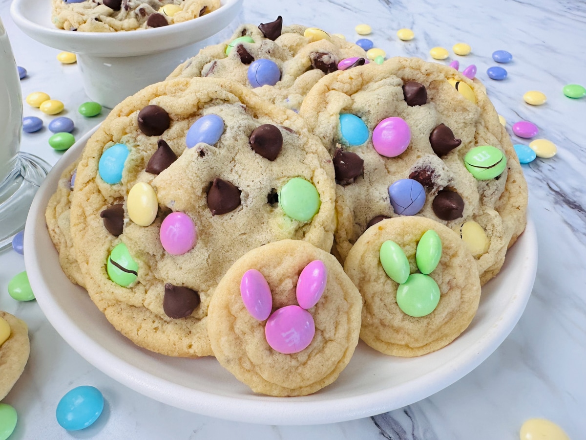 Close up of a plate filled with pastel M&M cookies. 