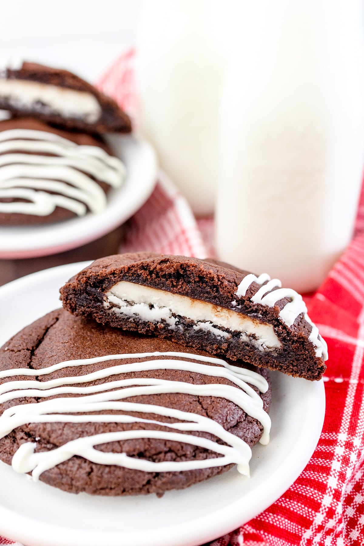 Two peppermint patty cookies on a white plate. 