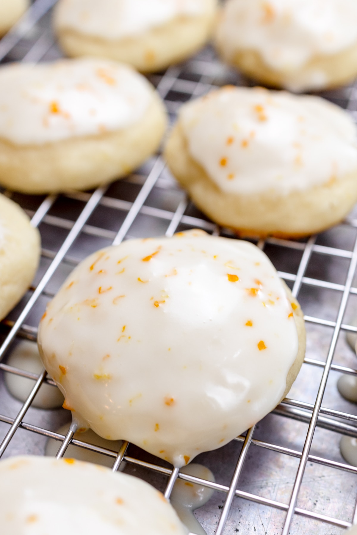 Close up of lemon ricotta cookies on a wire rack.
