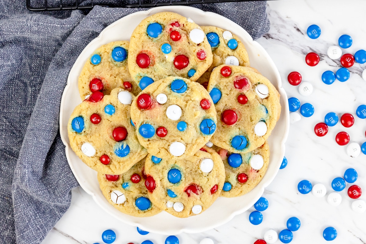 Top view of 4th of July Cookies on a white plate surrounded by red, white, and blue M&Ms.
