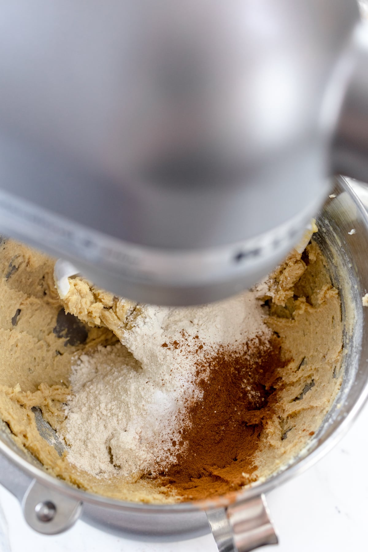 Close up of a stand mixer creaming ingredients for Oatmeal Butterscotch Cookies.