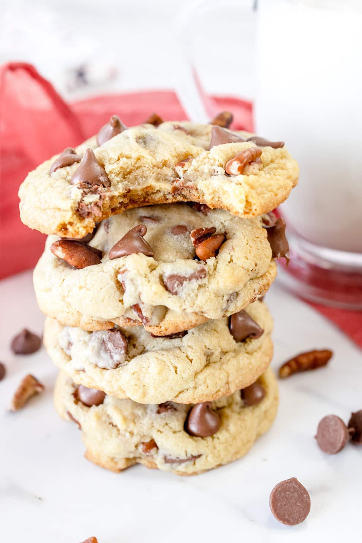 Close up of chocolate chip prcan cookies in a neat pile.