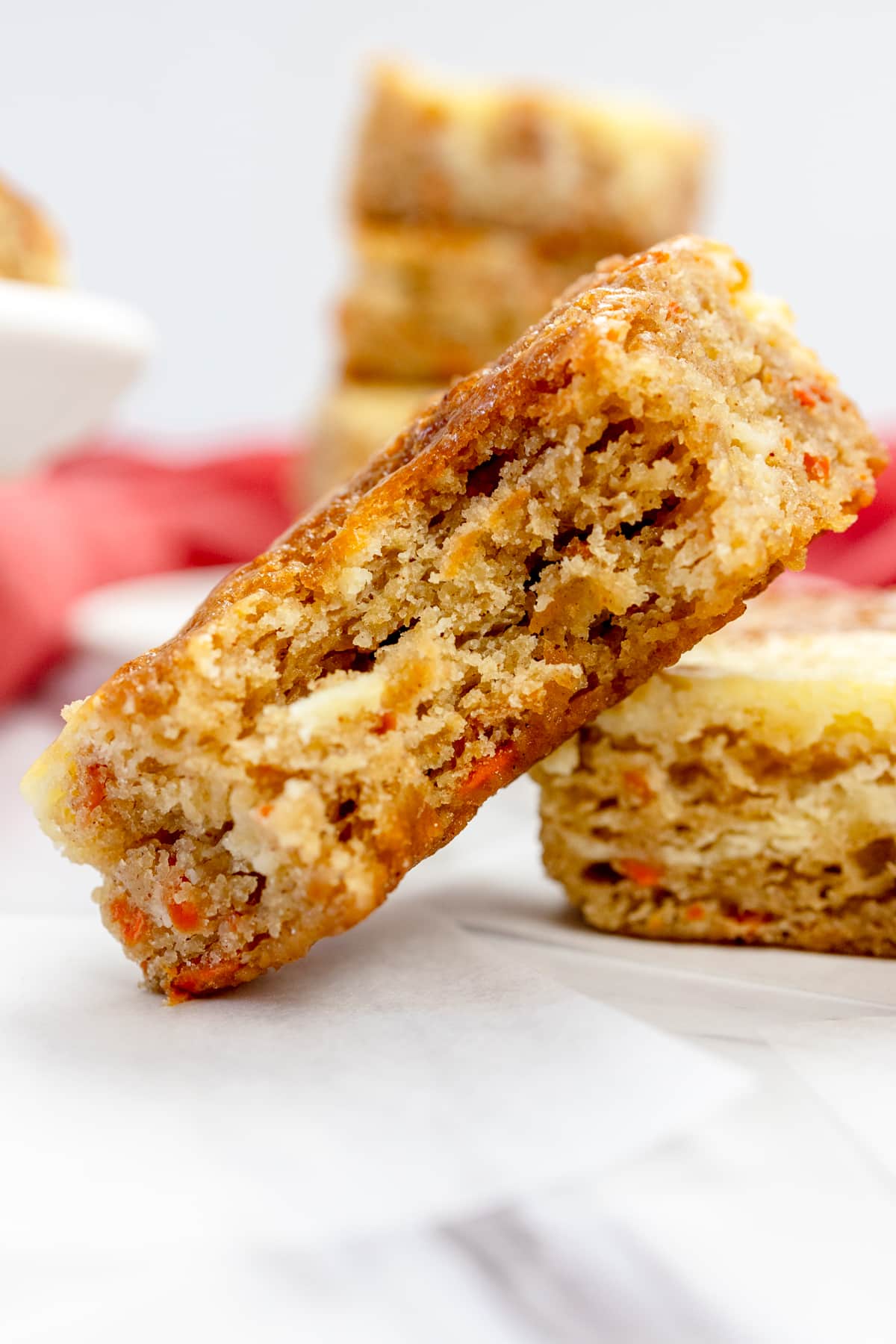 Carrot Cake Cheesecake Bars with bite taken out