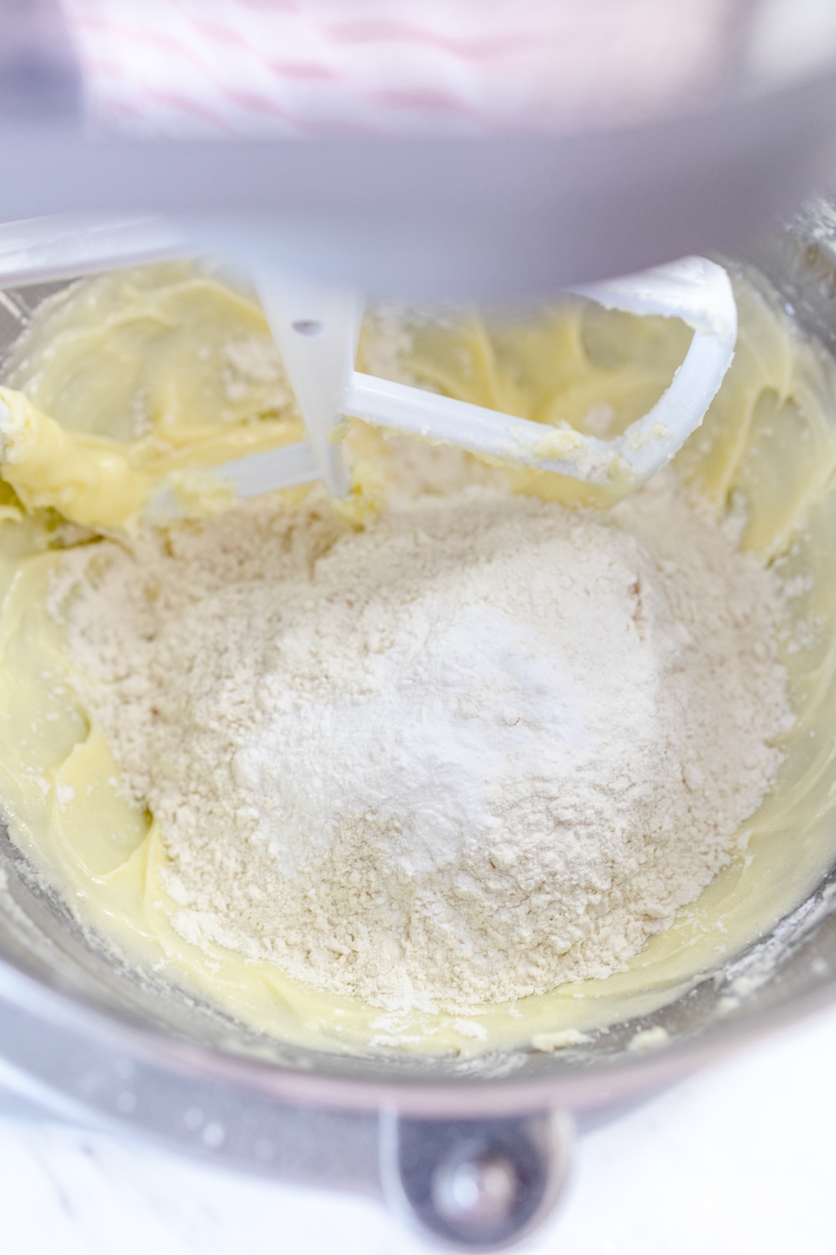Butter, sugar, egg, extract, oil, and flour in mixing bowl with paddle attachment