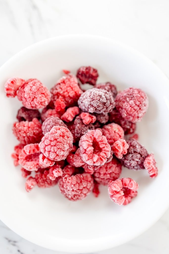 Frozen whole raspberries in bowl