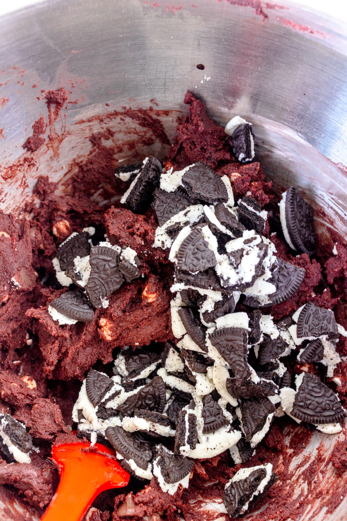 Mix in Oreo Cookie pieces with chocolate chips to Red Velvet Oreo Cookie dough