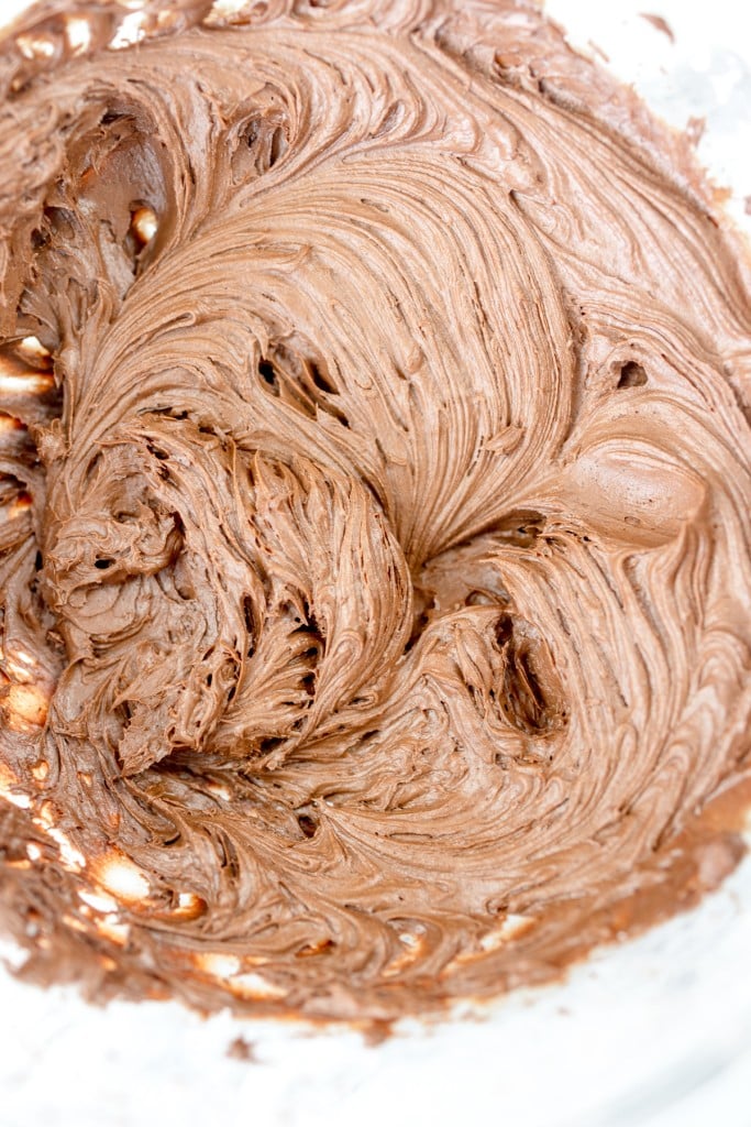 Top view close up of chocolate frosting whipped.