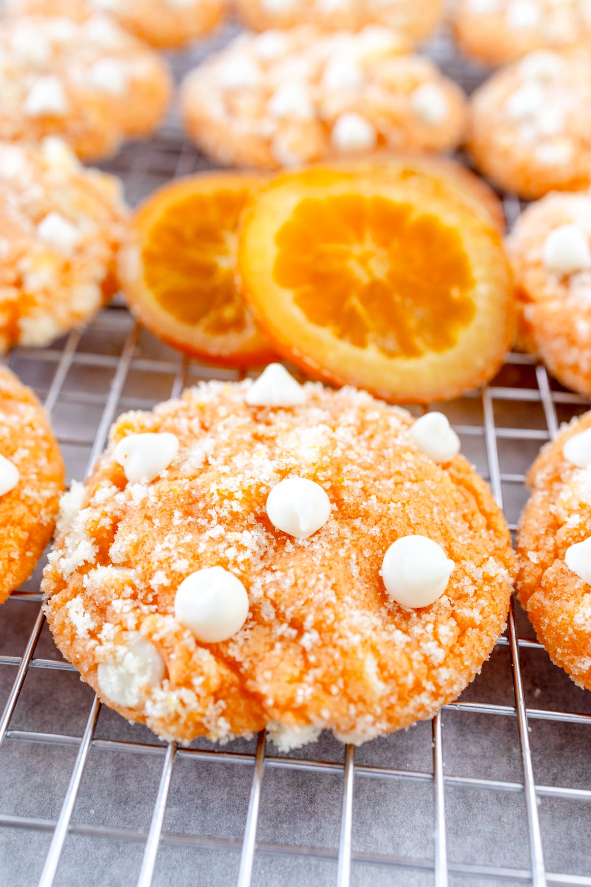 Close up of orange creamsicle cookies on a wire rack.