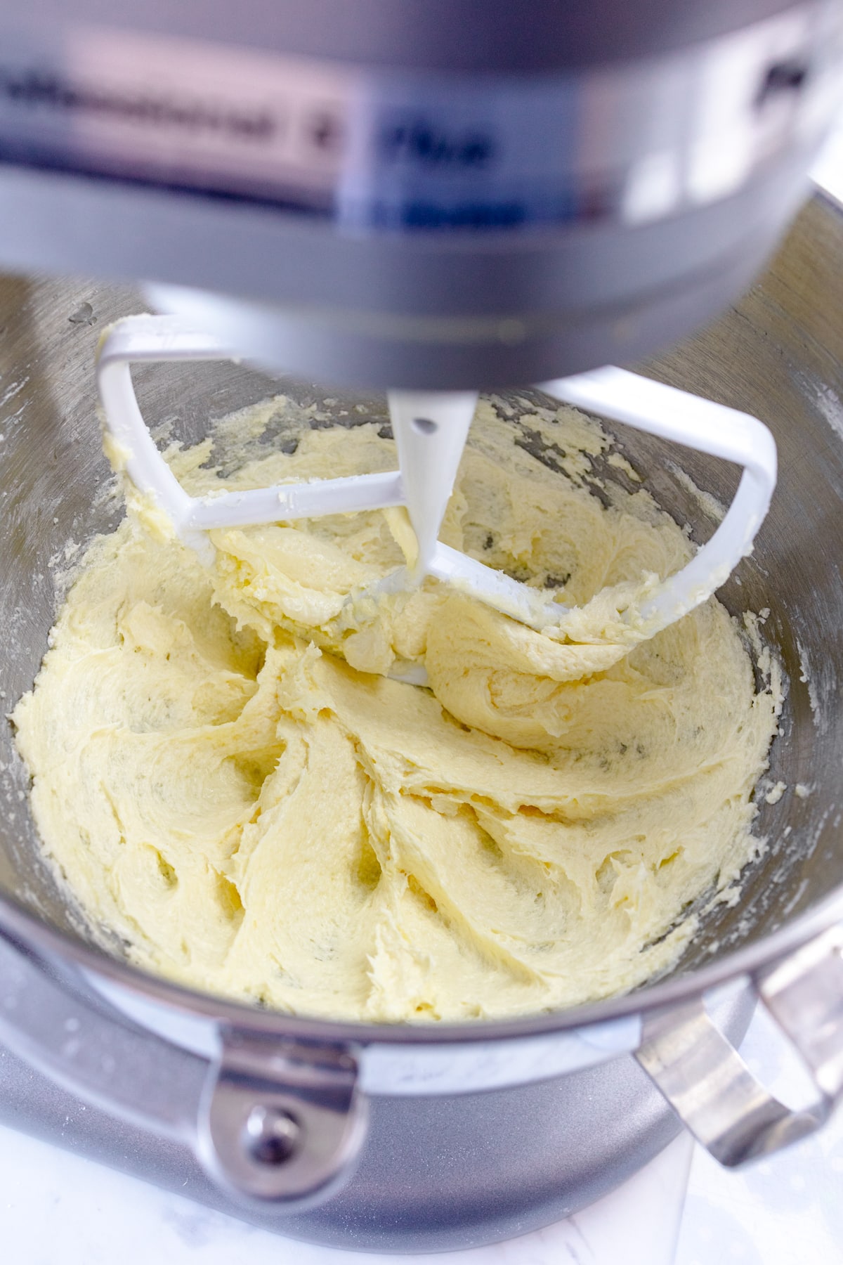 A large mixing bowl creamong together butter and granulated sugar.