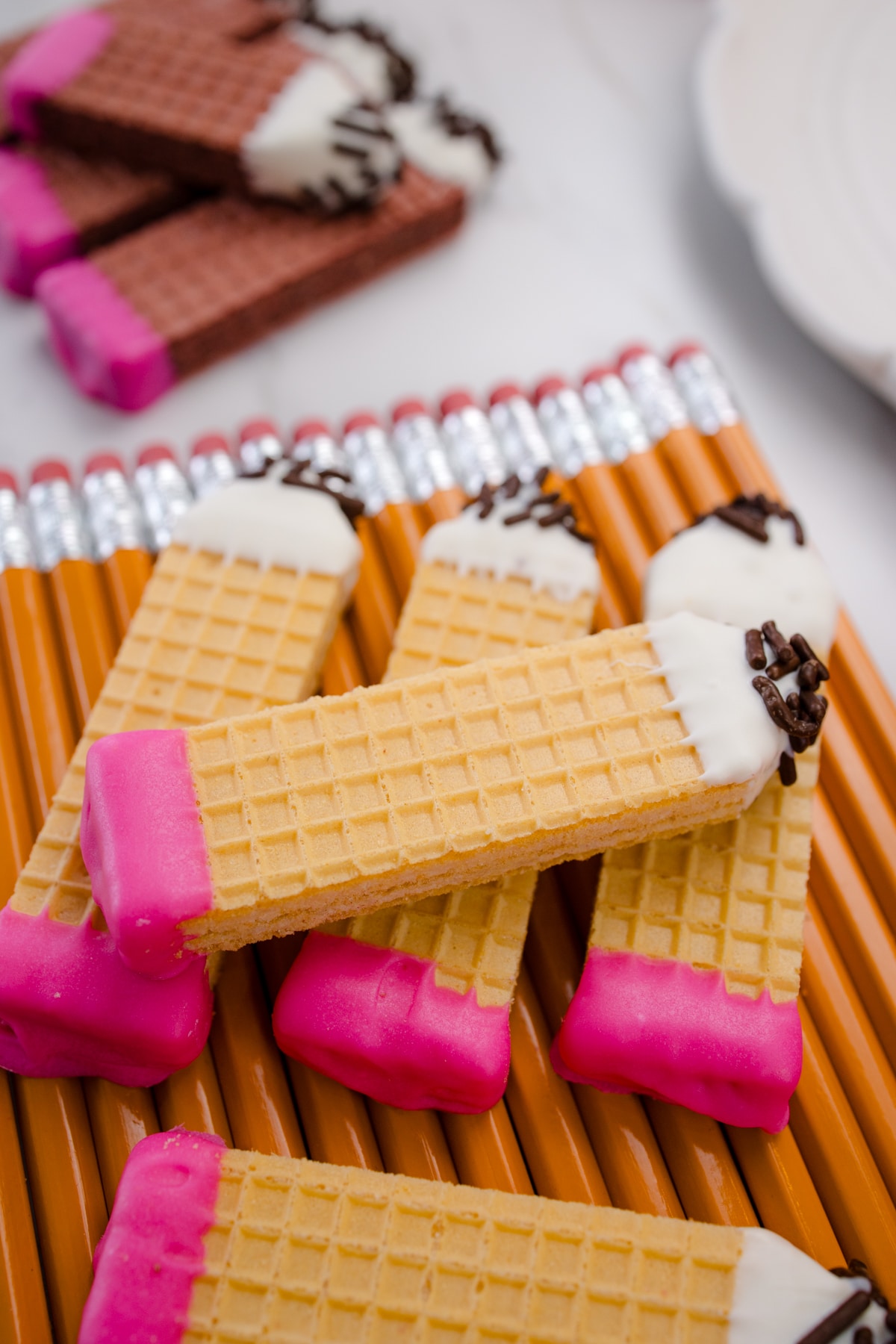 Pencil cookies on top of real pencils.