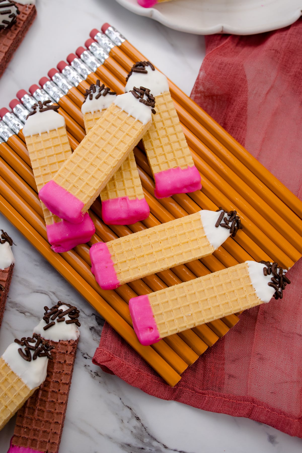 Pencil cookies on top of real pencils.