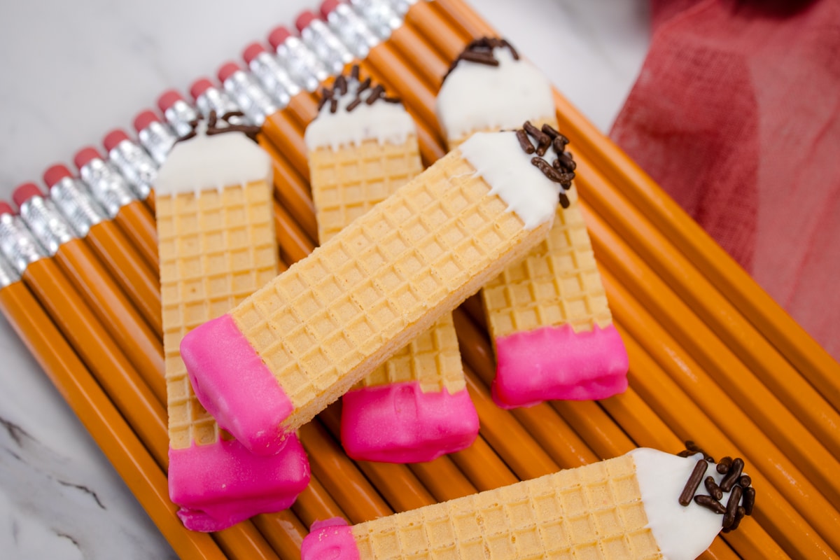 Pencil cookies on top of real pencils.