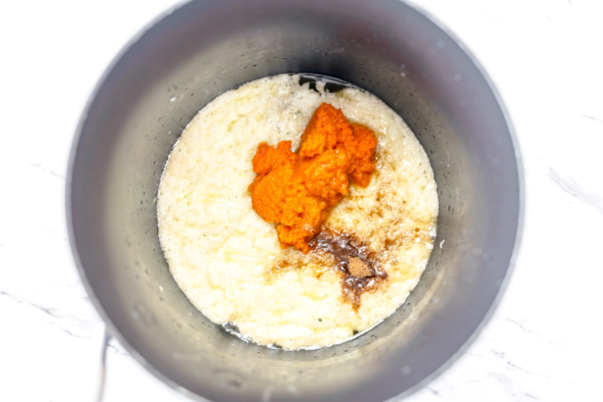 Pumpkin Puree and seasoning with butter and sugar mixture in sauce pan