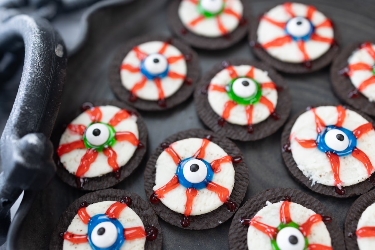 Close up of Eyeball Cookies on a black tray.