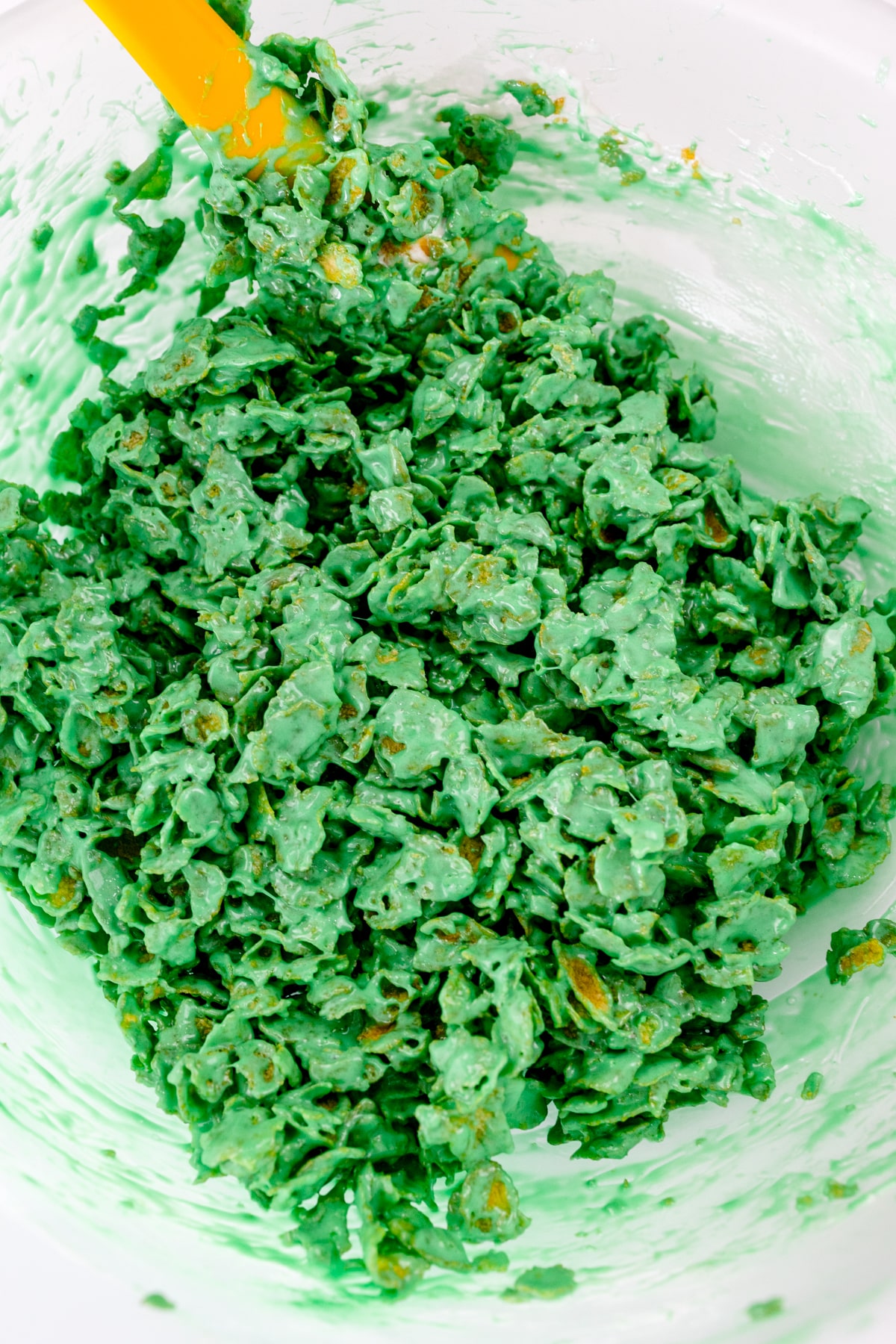 Top view of the cornflake mixture fully colored in green.