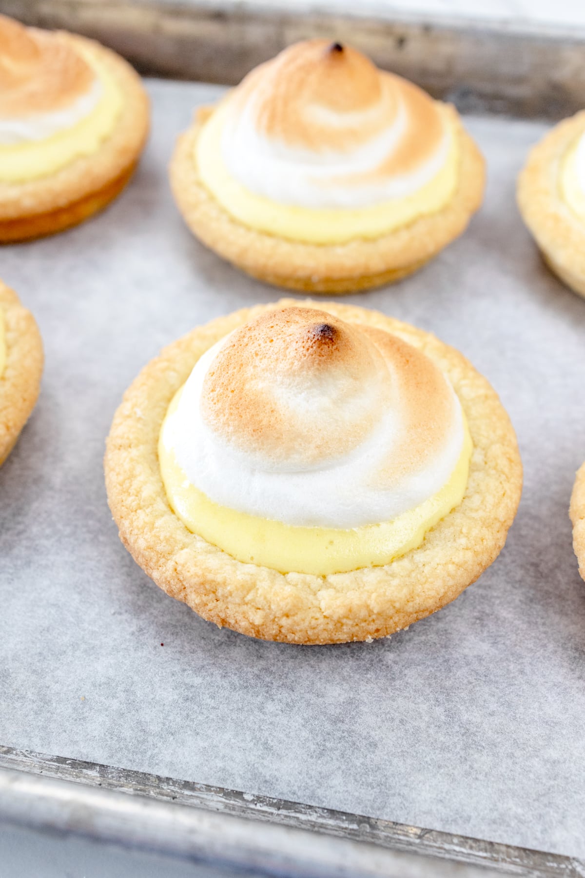Close up view of finished Lemon Meringue Cookies after being broiled in the oven.