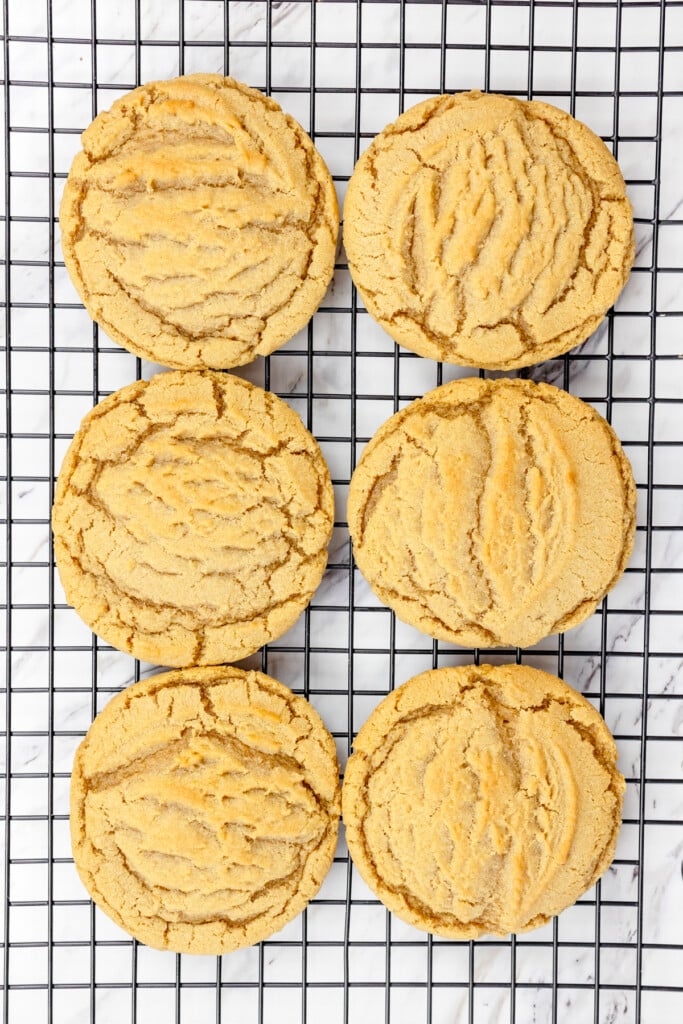 Top view of a wire rack with freshly baked Brown Butter Sugar Cookies on it.