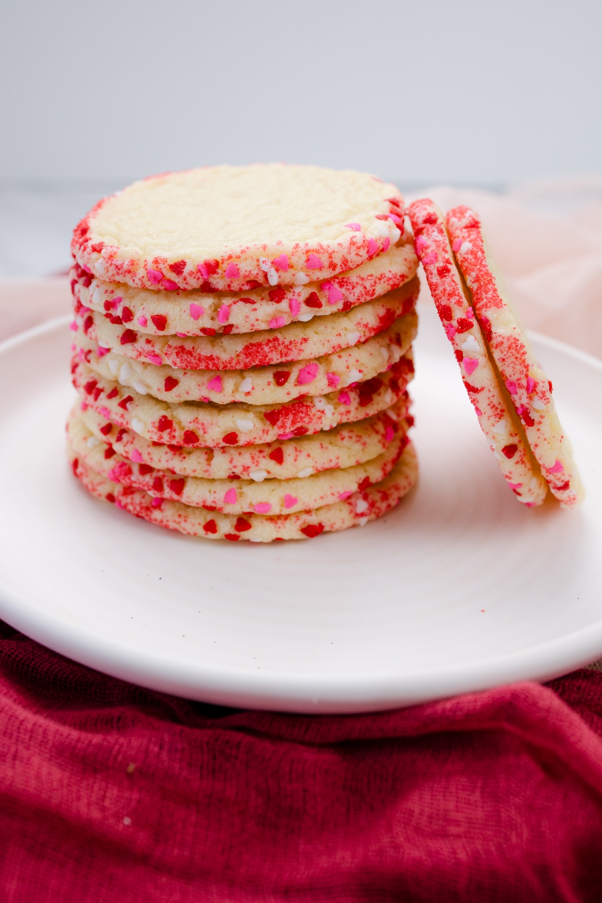 Close up view of a plate with a stack of Slice and Bake Sugar Cookies on it.
