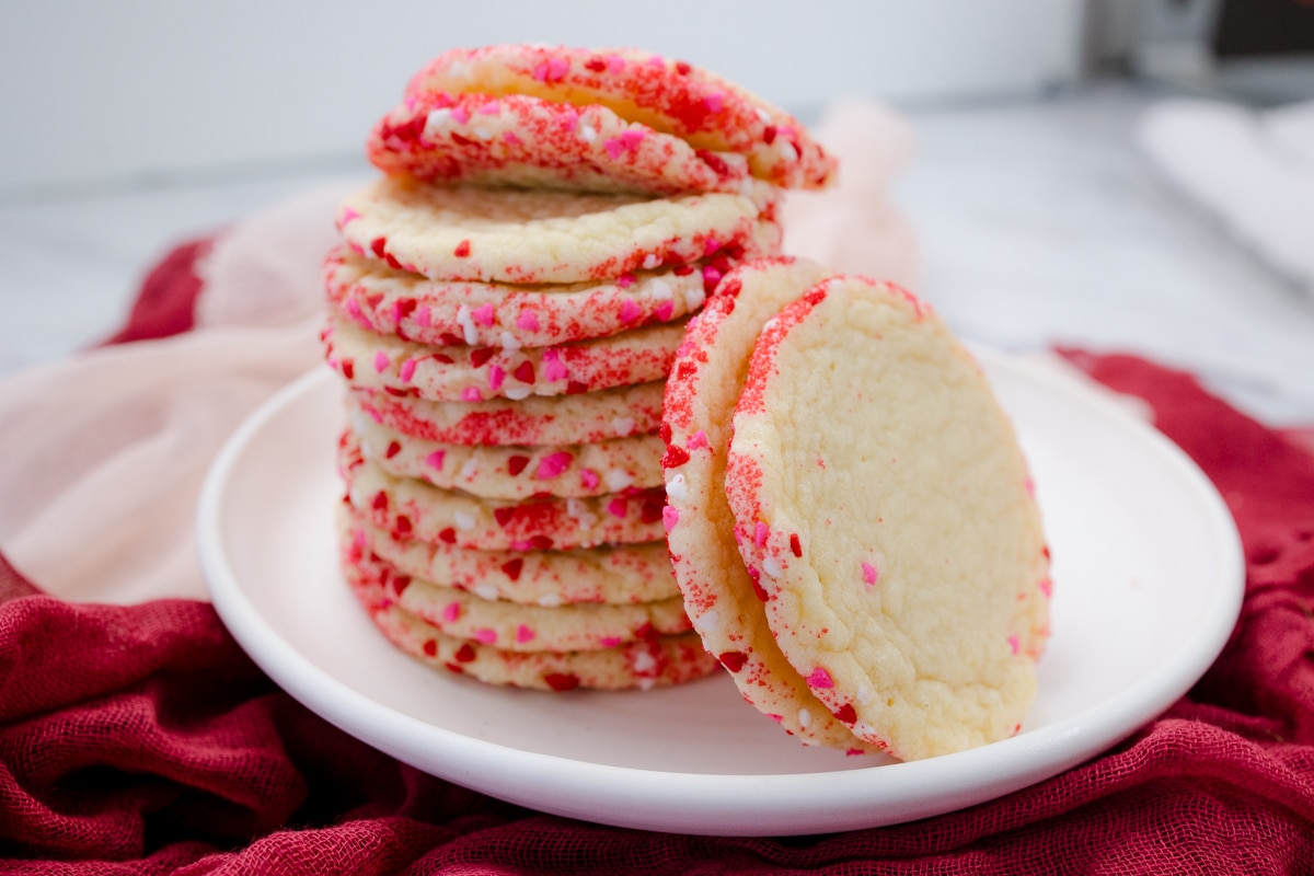 Close up view of a plate with a stack of Slice and Bake Sugar Cookies on it.