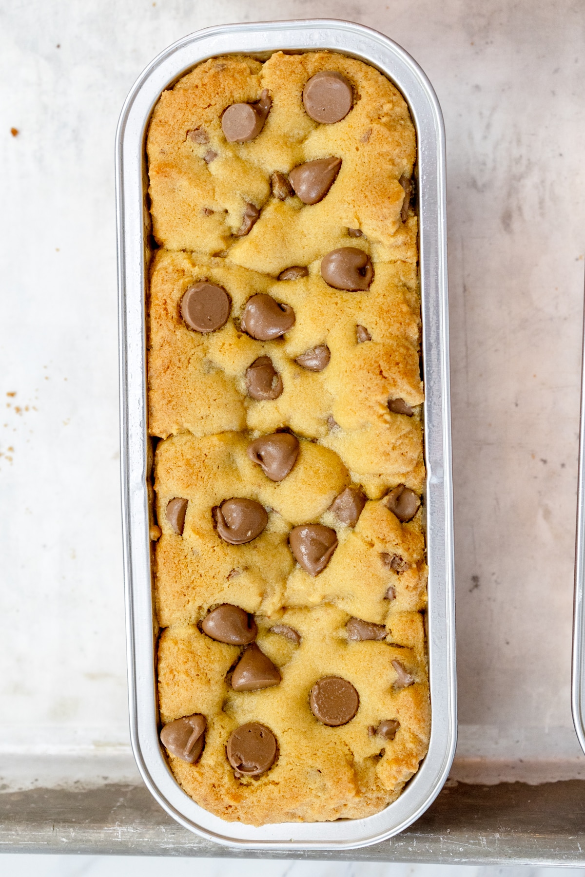 Top view of a Subway Footlong Cookie in a footlong baking tin.