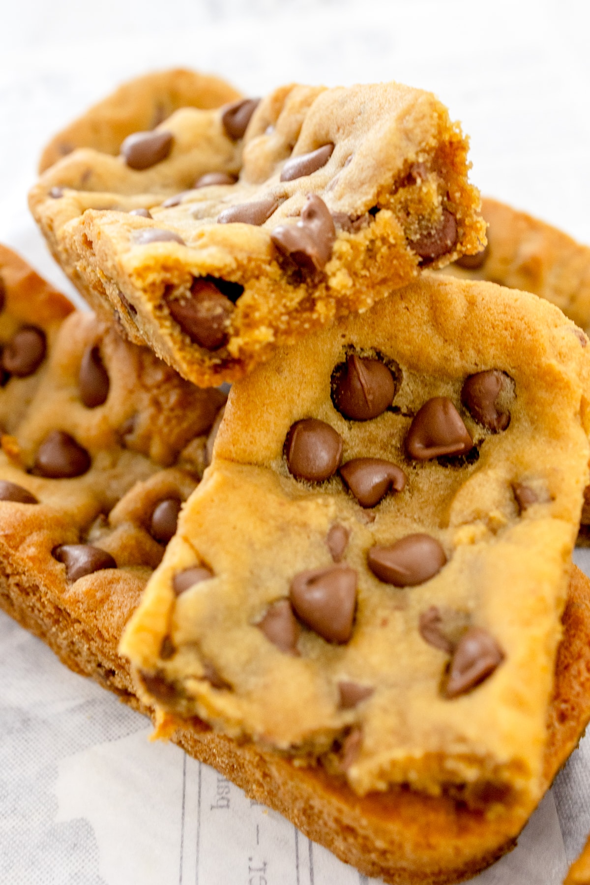 Close up of Subway Footlong Cookies stacked on top of each other.