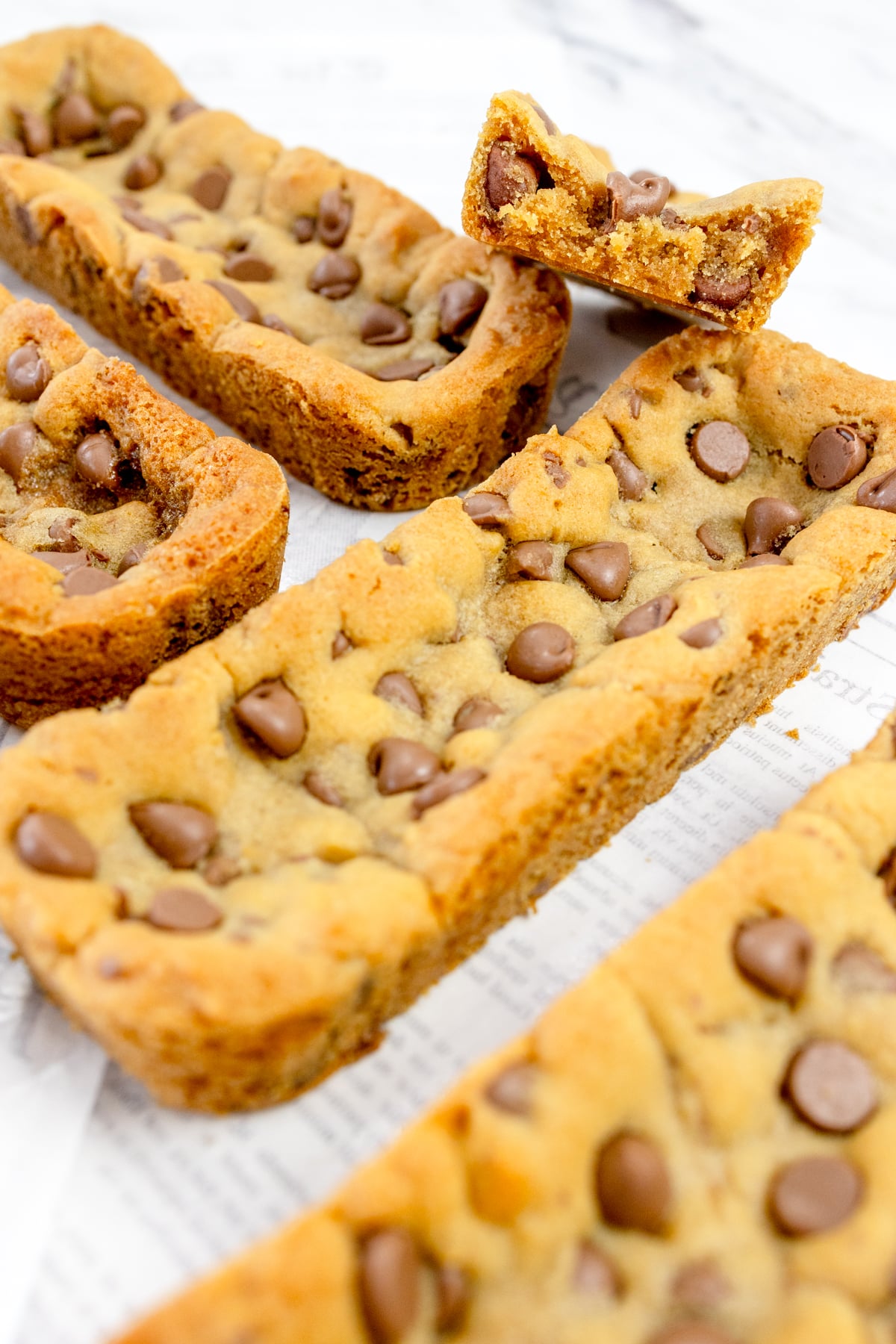 Close up of Subway Footlong Cookies on a white surface.