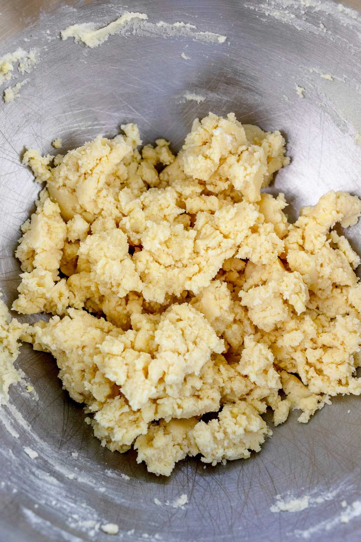 Overhead view of cookie dough in a mixing bowl.