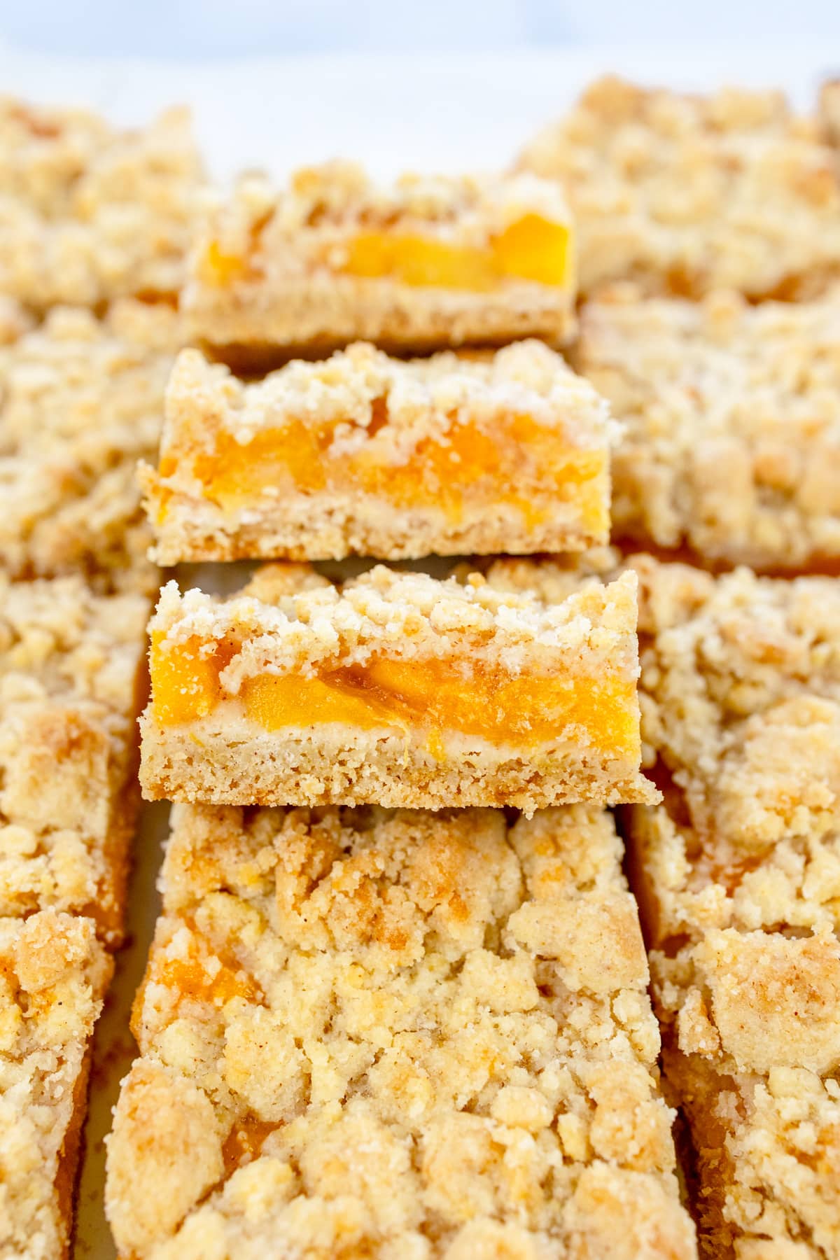 Close up image of Peach Pie Bars in a pile.