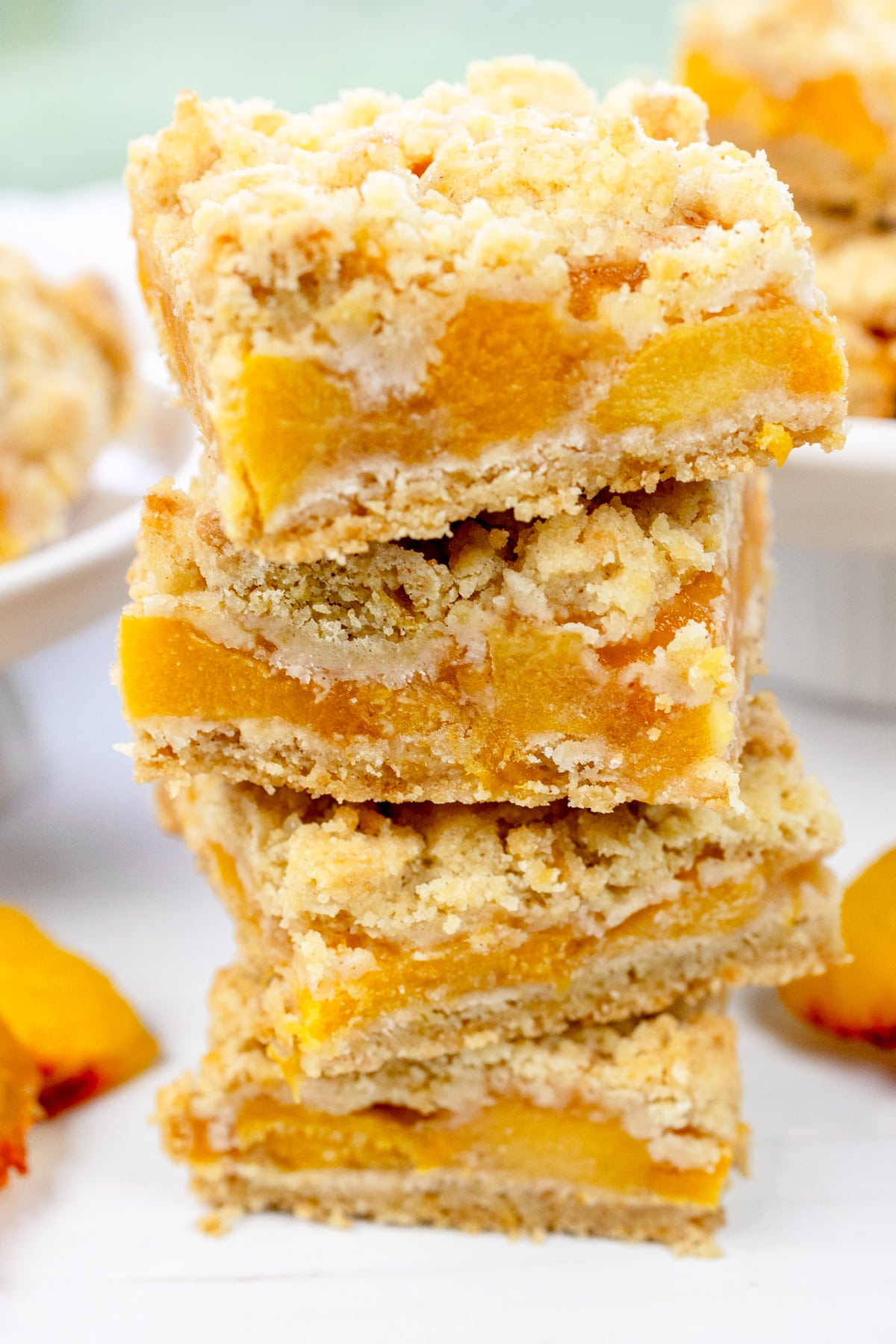 Close up image of four Peach Pie Bars in a stack.